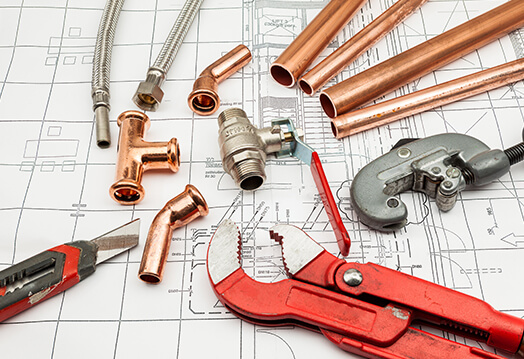 Plumbing supplies on a blueprint show a plumbing layout for a project in the Phoenix Metro Area.<br />
